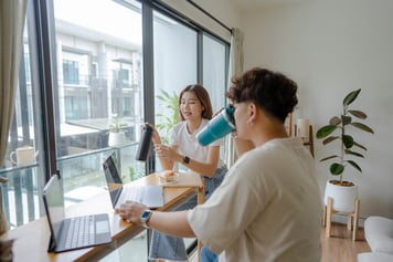 young employees talking casually while taking a break together