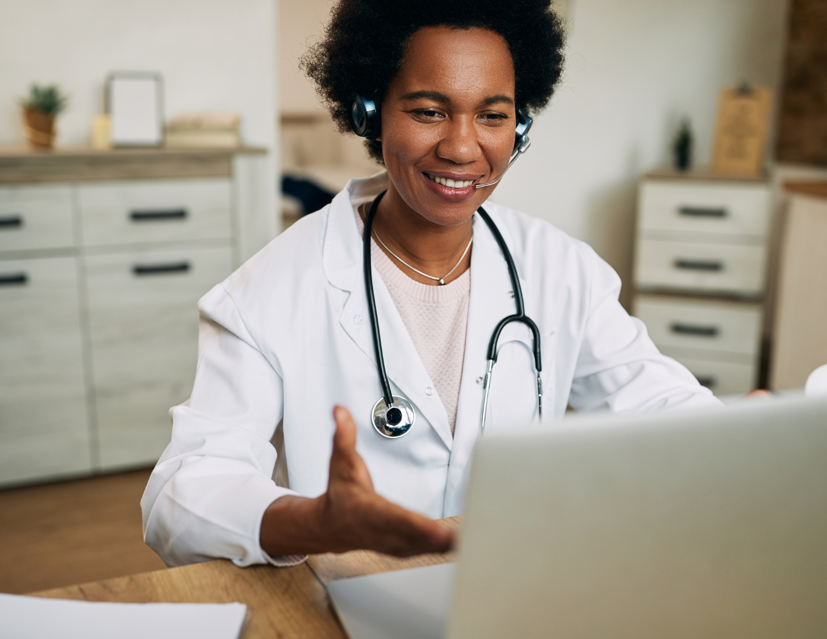 Female doctor talking on a laptop