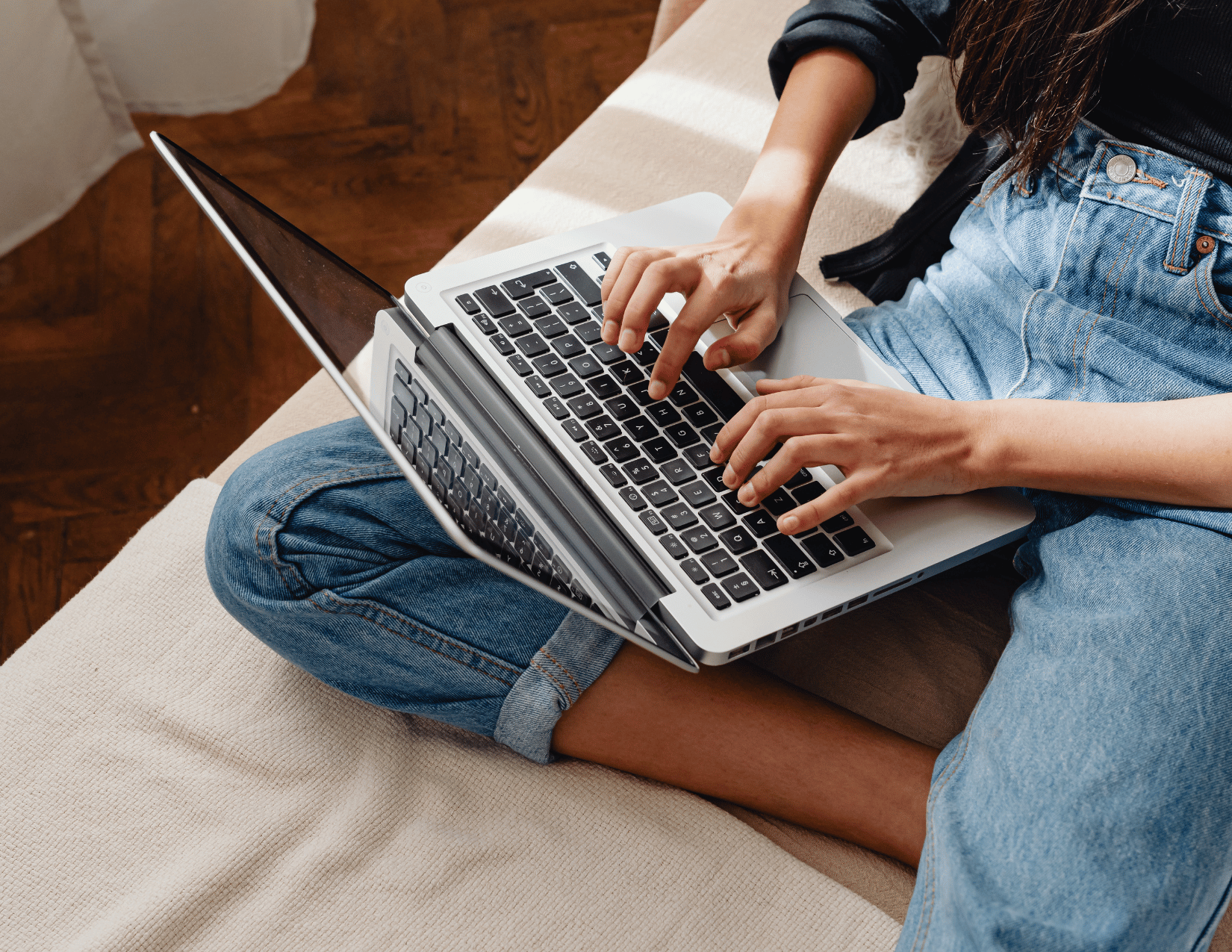 Person typing on their laptop